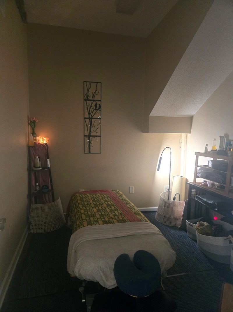 Sharon's treatment room at Blue Sage, a salt lamp glowing on the shelf