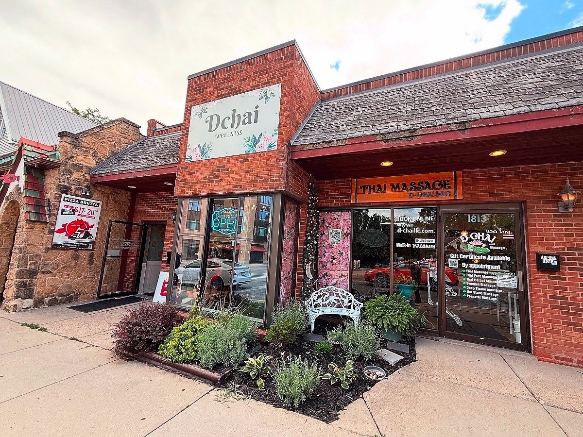 D-CHAI's brick storefront on Monroe Street, with a small garden by the door