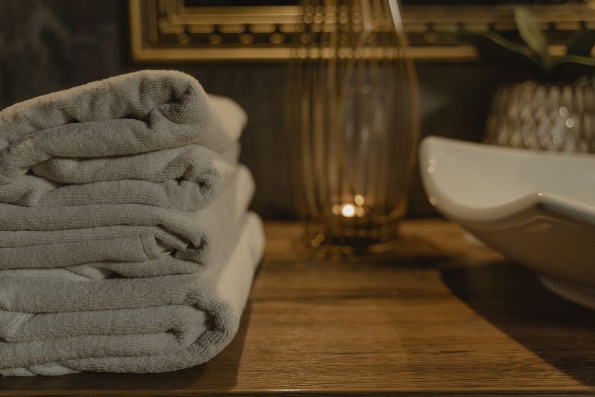 Soft folded towels by candlelight