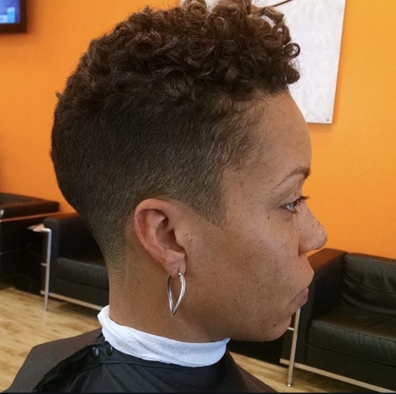 A short tapered cut with curls on top