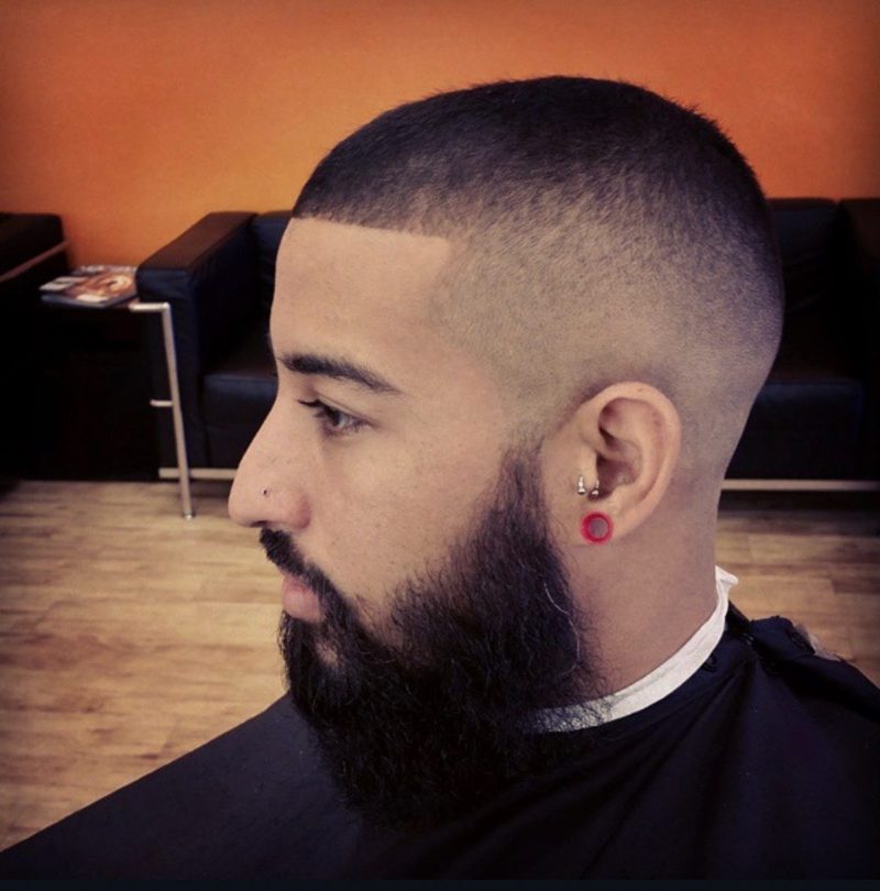 A high fade with a full beard lined up
